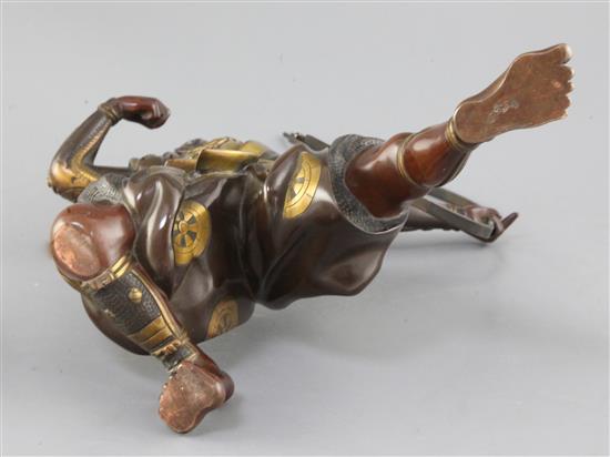 A Japanese bronze and parcel gilt figure of a kneeling archer, signed Yoshimitsu, Meiji period, height 37.5cm incl. carved wood stand